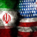 Iran and United States flags with smoky overlay