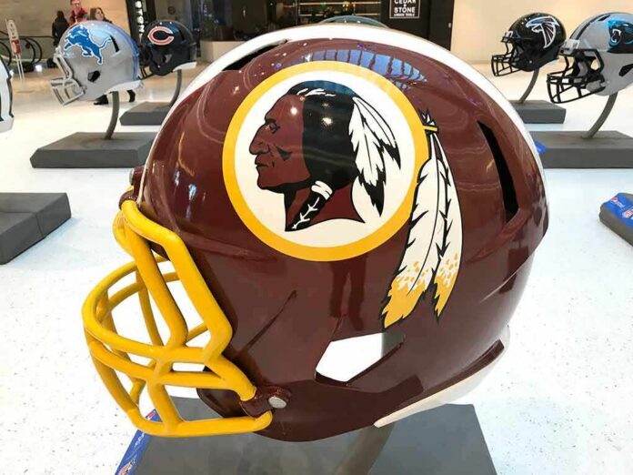 shutterstock_786833839 maroon football helmet with yellow facemask on display