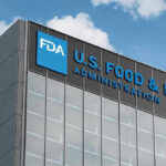 License Ambush Sparks First Amendment Fire FDA building with blue logo and sky background.
