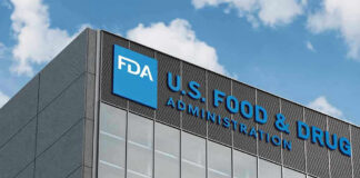 FDA building with blue logo and sky background.