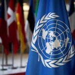 Sovereignty Under Siege — Voters Sidelined? United Nations flag among international flags