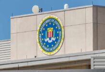 Texas Home Yields Bones – Case Explodes FBI emblem on a beige building facade