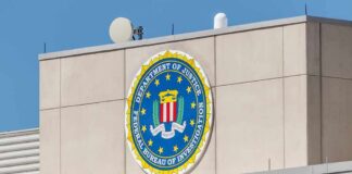 FBI emblem on a beige building facade