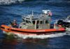 U.S. Coast Guard patrol boat speeding on open water