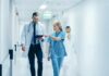 Gym Collapse Stuns: Hidden Time Bomb Burst Doctors walking in a hospital corridor reviewing a tablet