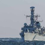 naval warship sailing on rough sea