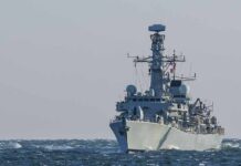 naval warship sailing on rough sea
