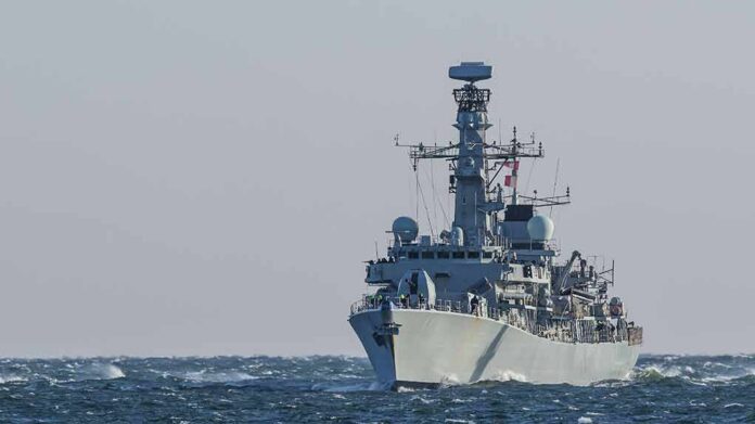 naval warship sailing on rough sea