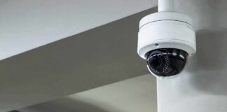 Dome security camera mounted on a ceiling corner