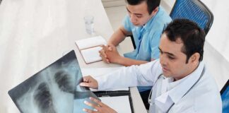 Doctors reviewing a chest X-ray at a desk