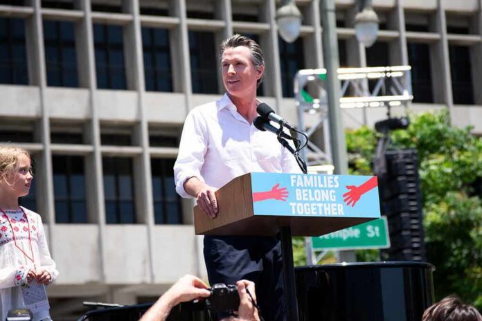 shutterstock_1747777526 Man speaking at a rally podium outdoors