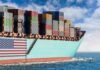 Cargo ship bow loaded with stacked containers at sea