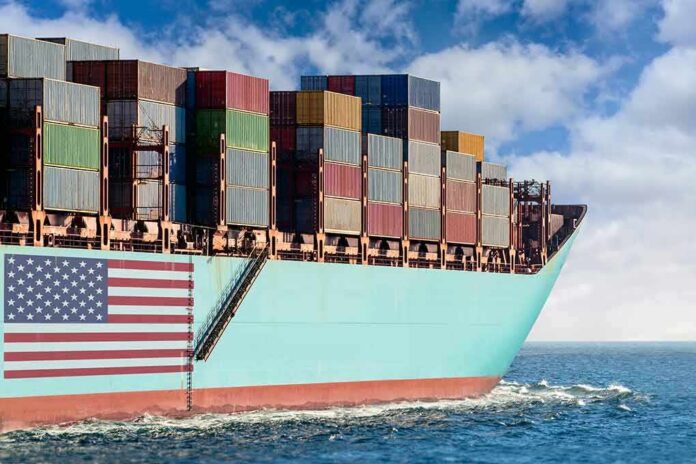 shutterstock_1800694378 Cargo ship bow loaded with stacked containers at sea