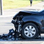 Damaged car with crushed front end after collision