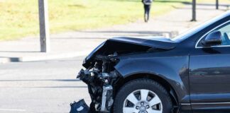 Damaged car with crushed front end after collision
