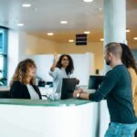 Luxury Tower Key Blunder Sparks Panic Reception desk with staff assisting visitors