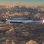A New Hypersonic Weapon Is Heading To The Fleet Hypersonic missile flying above clouds with bright exhaust flame