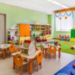 State-Mandated Age Signals Hit Devices Preschool classroom with colorful furniture and toys