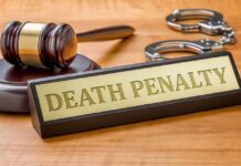 TV Star Hit With Death Sentence Gavel, handcuffs, and a nameplate reading death penalty on a wooden desk