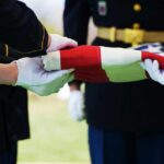 Pentagon Dawn Ritual Stuns Commuters Military personnel folding a flag during a ceremonial event