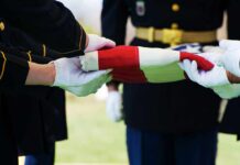 Pentagon Dawn Ritual Stuns Commuters Military personnel folding a flag during a ceremonial event