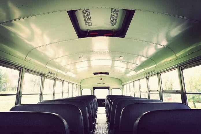 Empty school bus interior with rows of seats