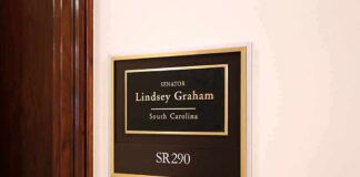 office wall plaque with black and gold nameplate and room number