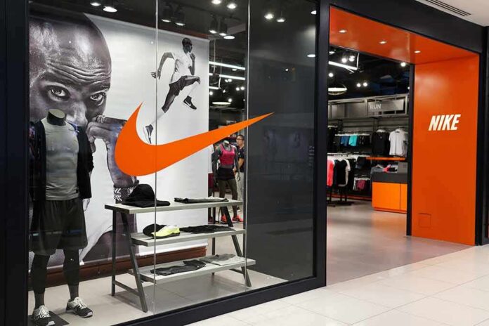 Nike retail store entrance with window display and mannequins