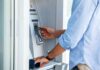 Person using an ATM with a bank card