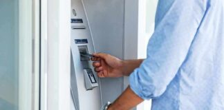 Person using an ATM with a bank card
