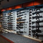 25 States Ask Supreme Court to Take Gun Case Wall display of rifles in a gun store