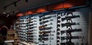 Wall display of rifles in a gun store