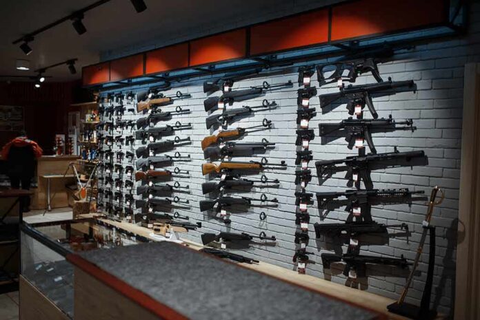 shutterstock_1668328855 Wall display of rifles in a gun store