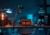podcast studio desk with on air sign and microphones