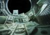 US dollar bills inside a washing machine drum