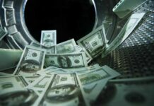 US dollar bills inside a washing machine drum