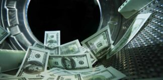 US dollar bills inside a washing machine drum