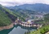 Hydroelectric dam in a green mountain valley