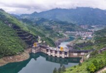 Hydroelectric dam in a green mountain valley