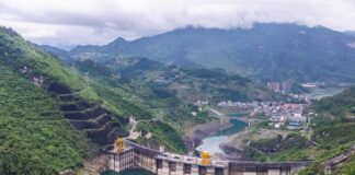 Hydroelectric dam in a green mountain valley