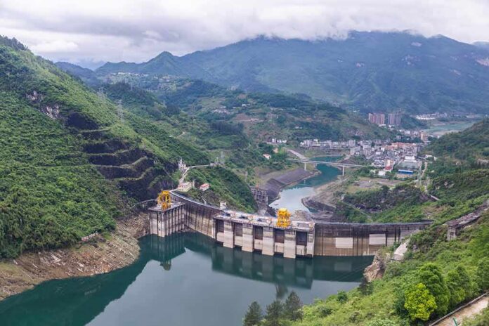 Hydroelectric dam in a green mountain valley