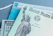 $500 Refund Checks Are Arriving in 30 States U.S. Treasury check with face mask and hundred-dollar bill