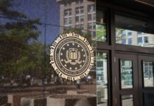 Judge’s Warrant, Hundreds Of Boxes Gone FBI seal on a building entrance