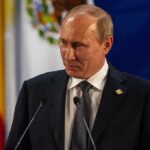 Developer Sues City Over 39 Story California Tower Vladimir Putin at a podium during a formal event