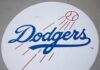 Dodgers logo with baseball and motion lines
