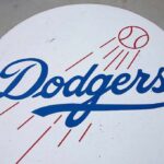 Dodgers logo with baseball and motion lines