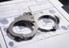 Handcuffs on a fingerprint record form