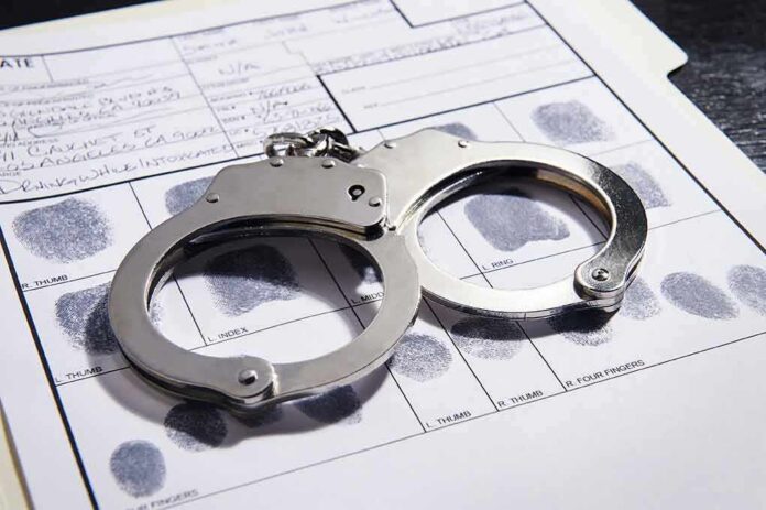 Handcuffs on a fingerprint record form